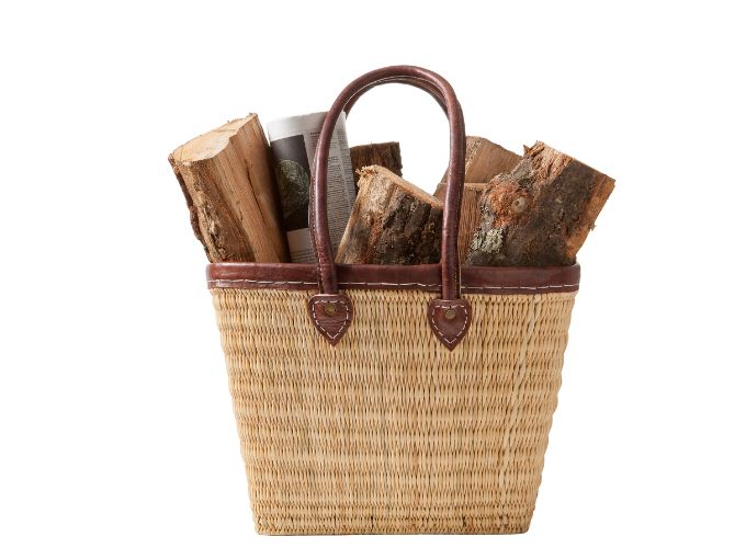 Firewood for fireplace in a wicker basket
