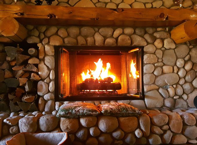 Is it dangerous to leave an open fireplace burning at night?